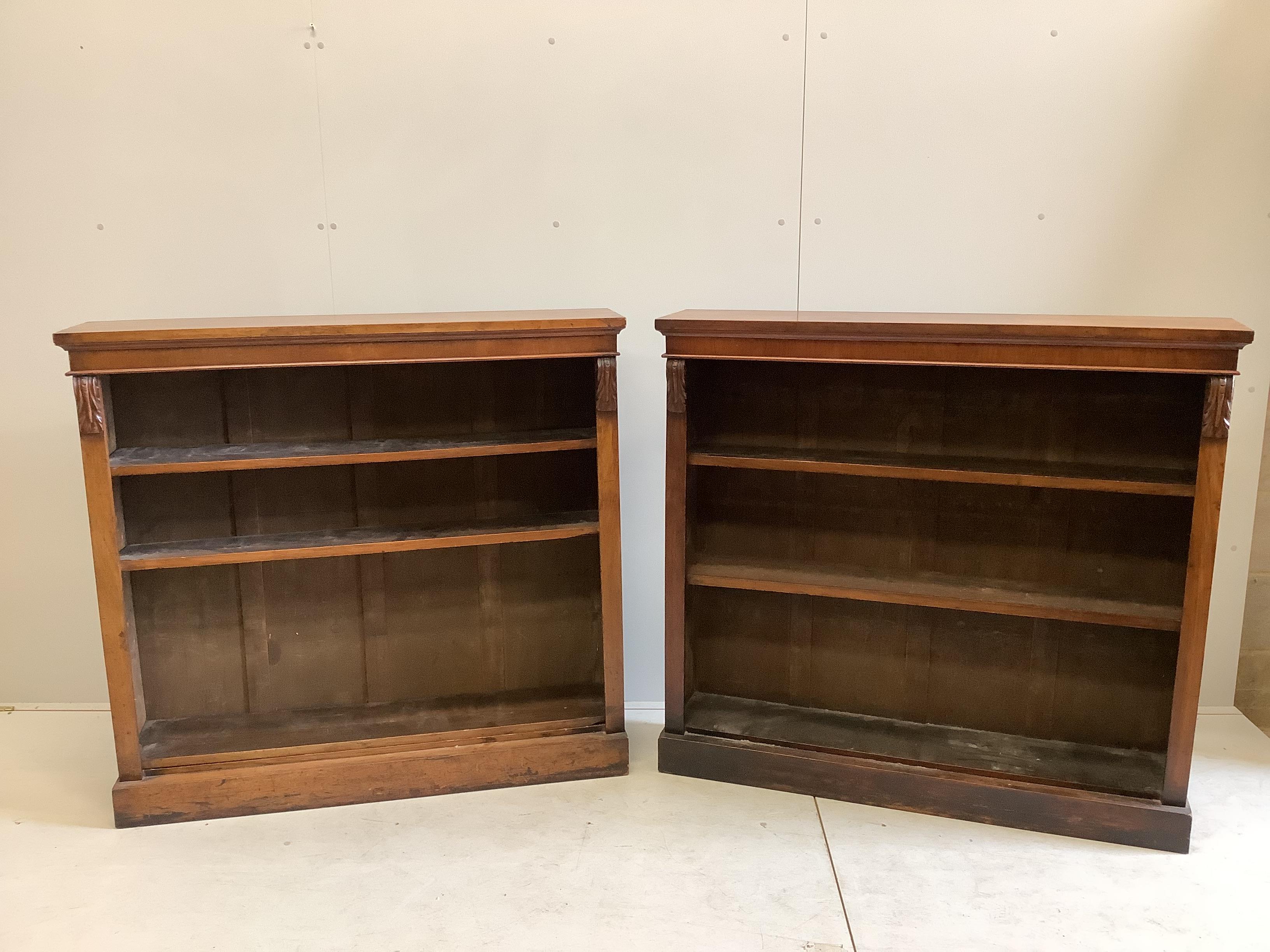 A pair of Victorian walnut open bookcases, width 120cm, depth 27cm, height 112cm